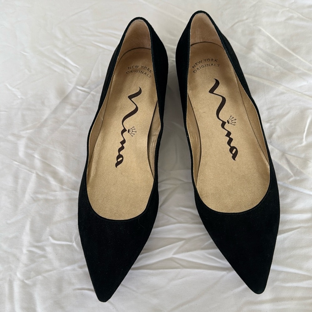 Nina black suede flat with studded, metallic 3/4 inch heel.